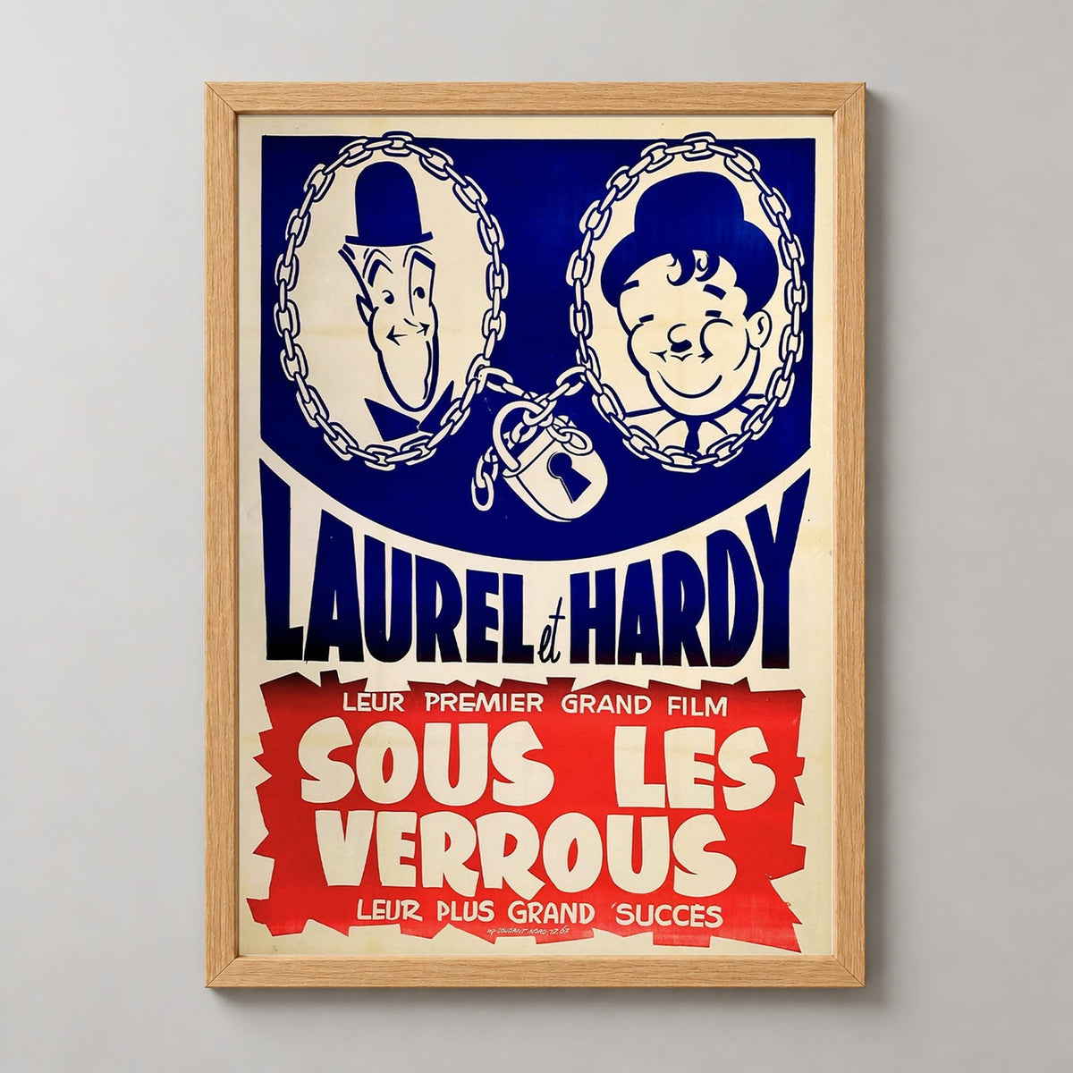 Laurel and Hardy 'Sous Les Verrous' - Vintage Movie Poster Art Print — realistic natural wood frame studio view