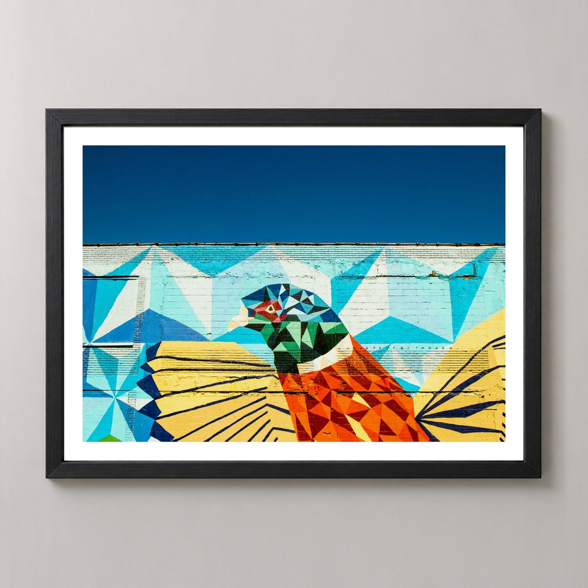 Detroit Wall Art | Colourful Bird — realistic black frame studio view with white border