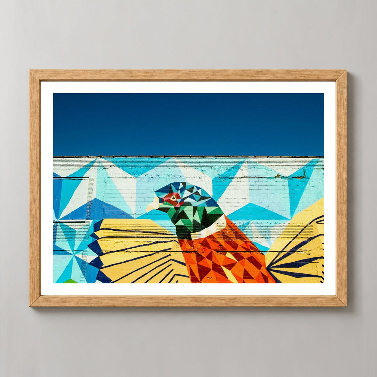 Detroit Wall Art | Colourful Bird — realistic natural wood frame studio view with white border