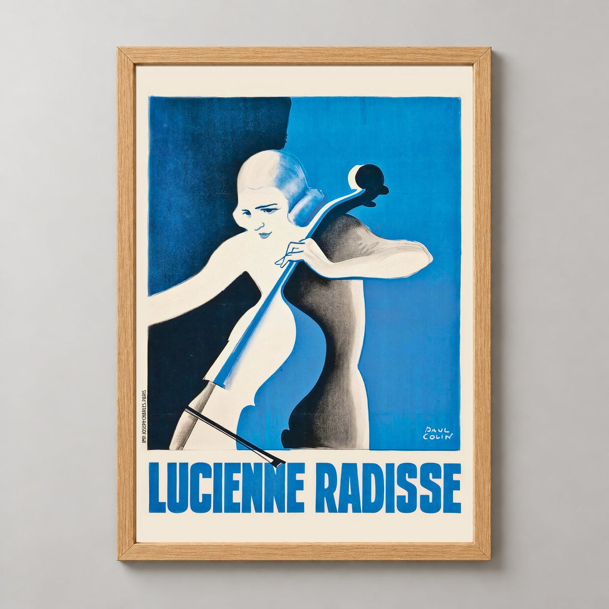 Lucienne Radisse by Paul Colin Vintage Art Deco Poster — realistic natural wood frame studio view