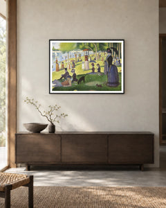 A Sunday on La Grande Jatte Art Print by Georges Seurat in a black frame; styled landscape setting.