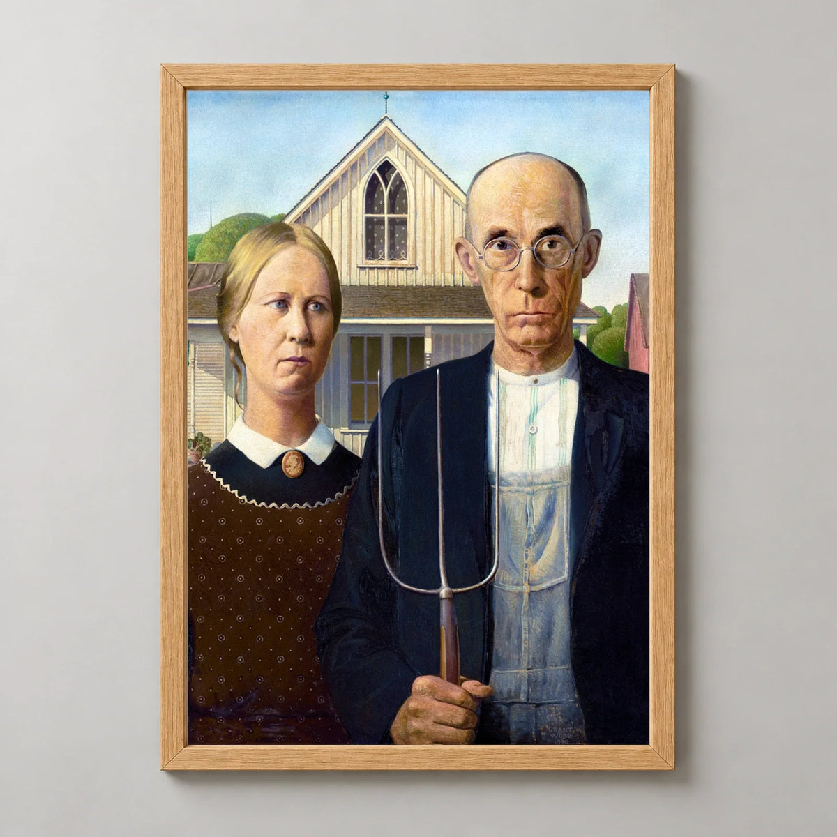 American Gothic Art Print by Grant Wood in a natural wood frame, front view