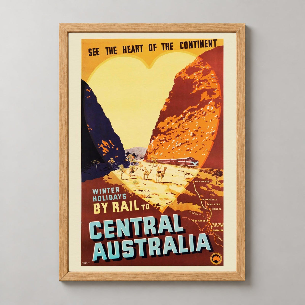 Winter Holidays By Rail | Central Australia Vintage Poster — realistic natural wood frame studio view