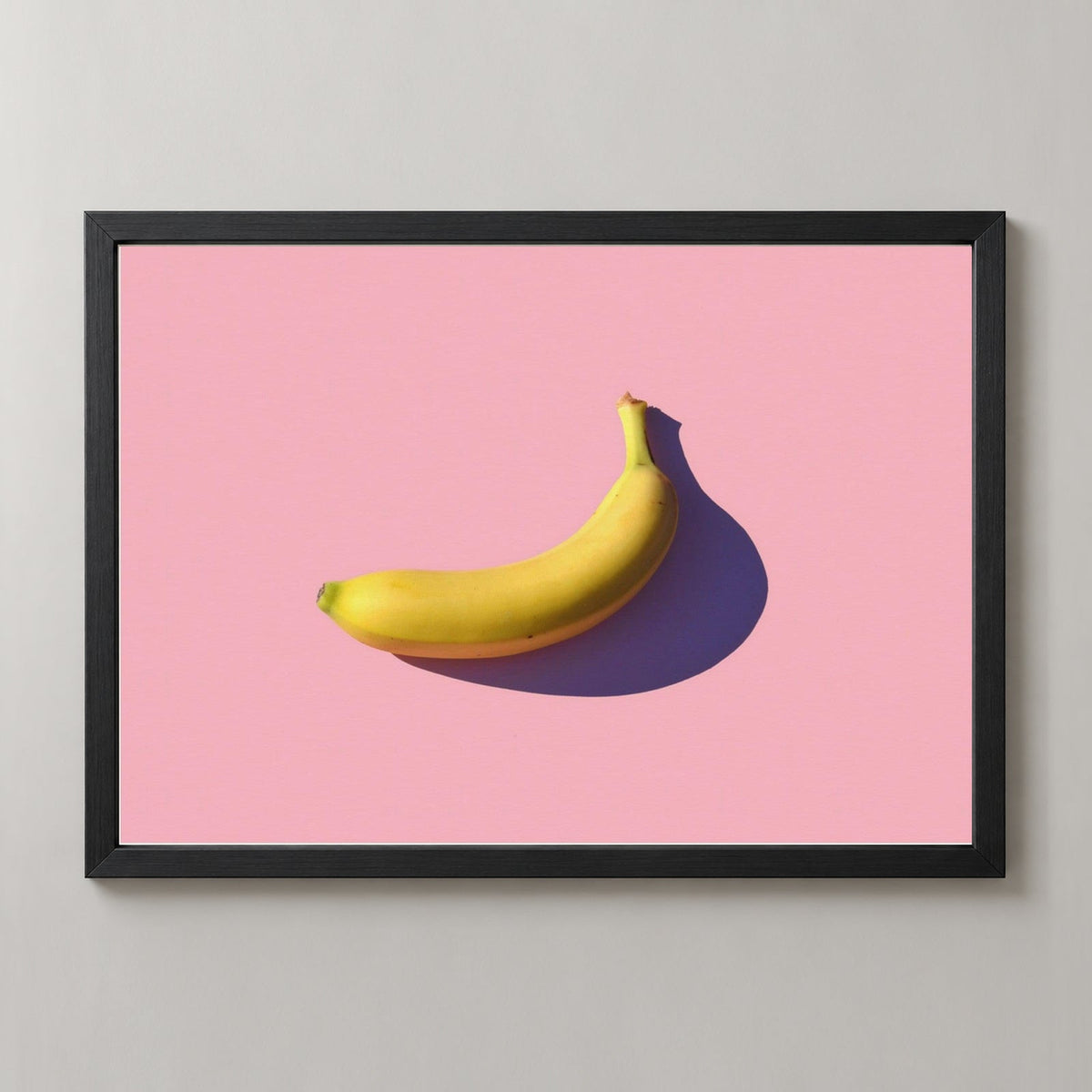 Minimal Banana — realistic black frame studio view