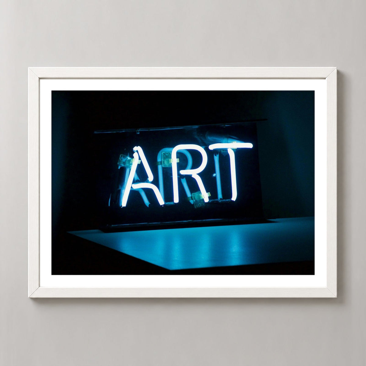 Art in Neon — realistic white frame studio view with white border