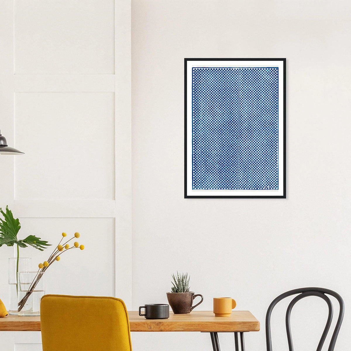 Blue Checkerboard in a black frame above a dining table; styled room mockup