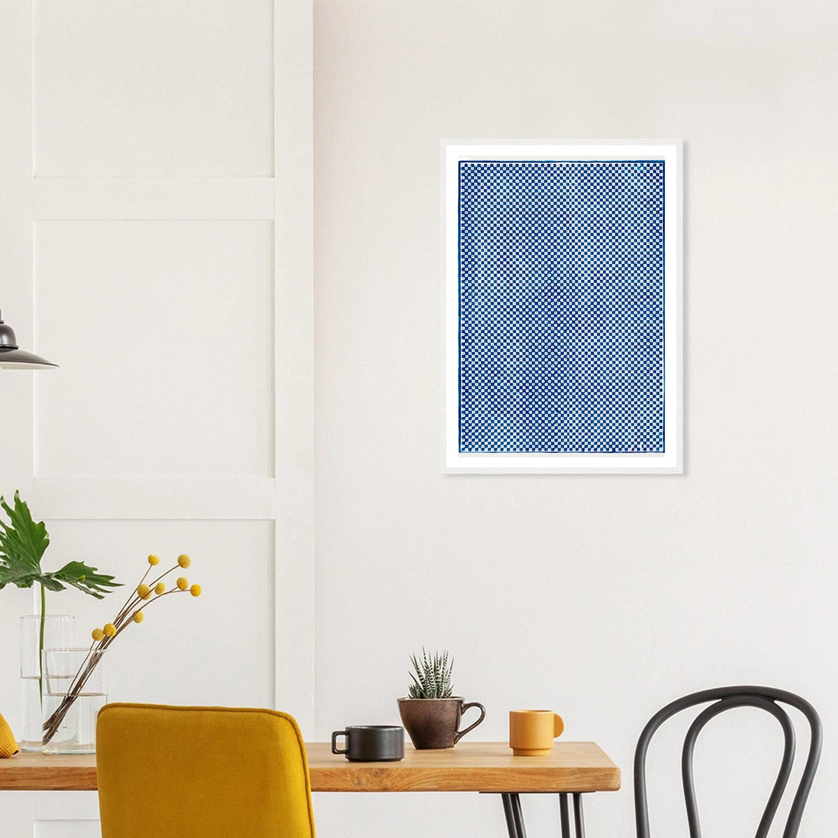 Blue Checkerboard in a white frame above a dining table; styled room mockup