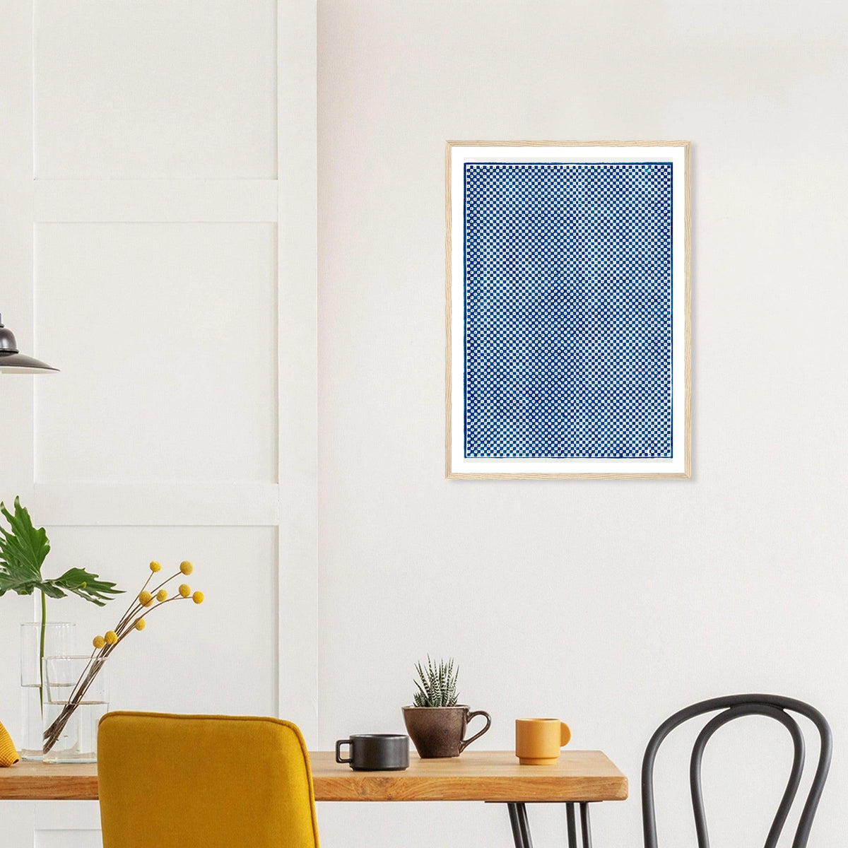 Blue Checkerboard in a natural wood frame above a dining table; styled room mockup