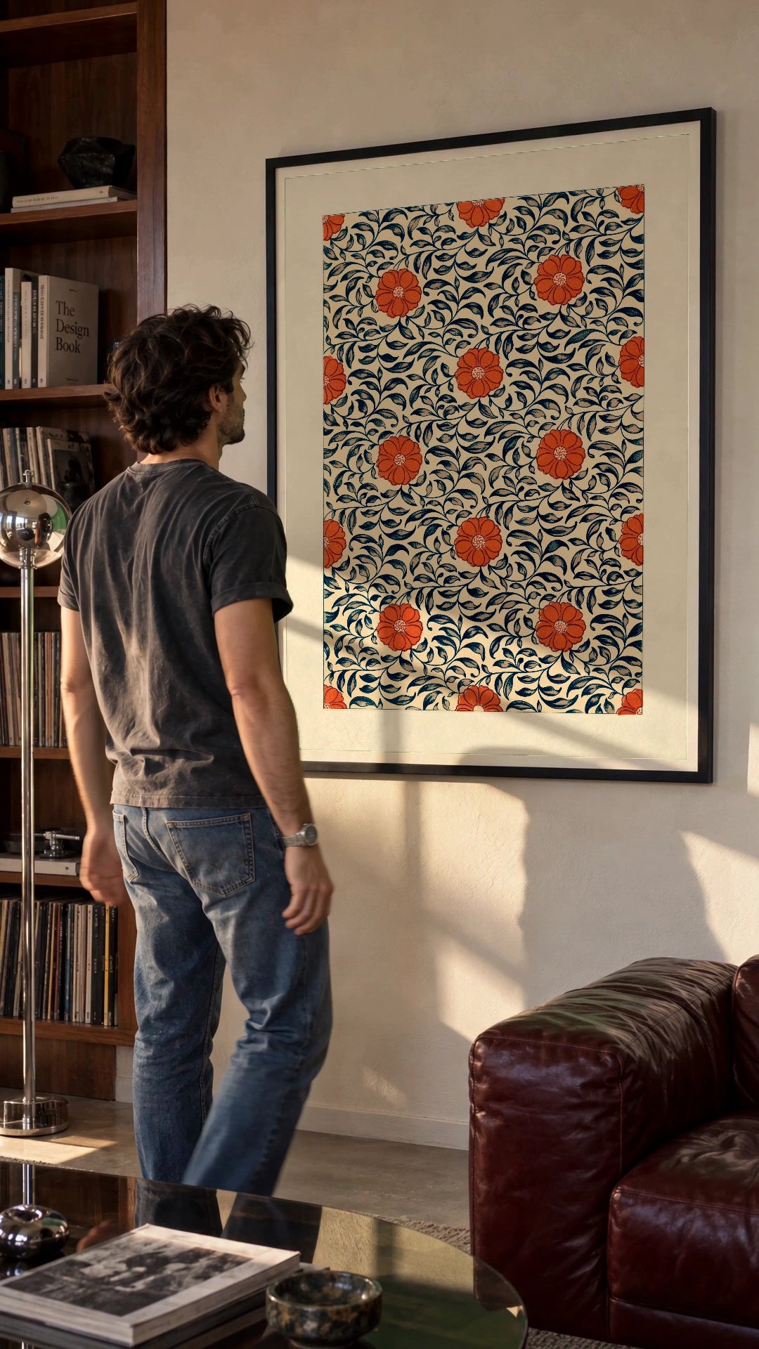 Chinese Ornament — Floral Plate in a black frame being hung on a wall; styled scene