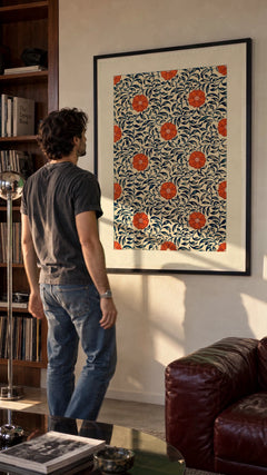 Chinese Ornament — Floral Plate in a black frame being hung on a wall; styled scene