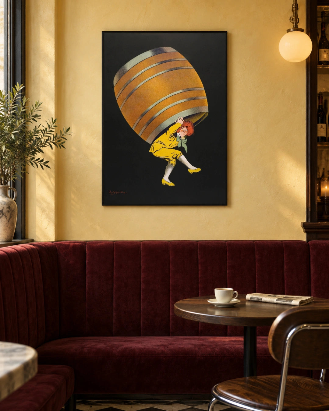 Cognac Pellisson Vintage Art Print by Leonetto Cappiello (1907) in a black frame; styled bistro setting.