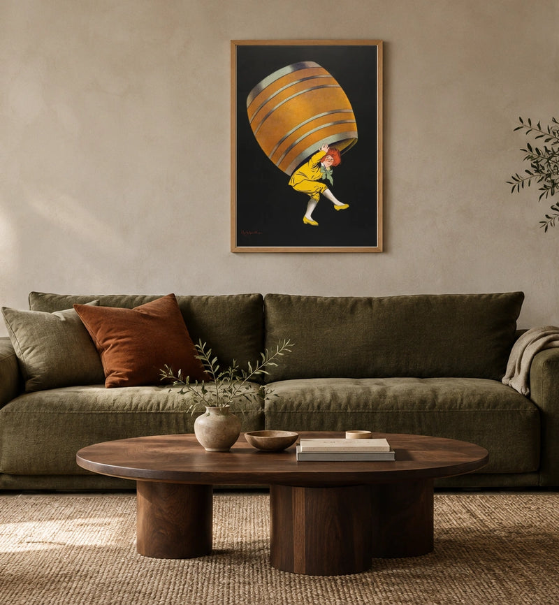 Cognac Pellisson in a natural wood frame above an olive sofa; styled living-room mockup