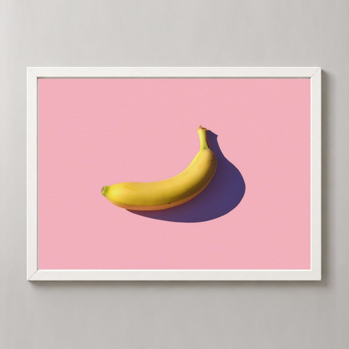 Minimal Banana — realistic white frame studio view