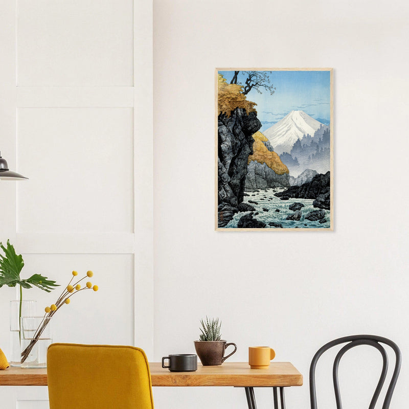 Foot of Mount Ashitaka in a natural wood frame above a dining table; styled room mockup