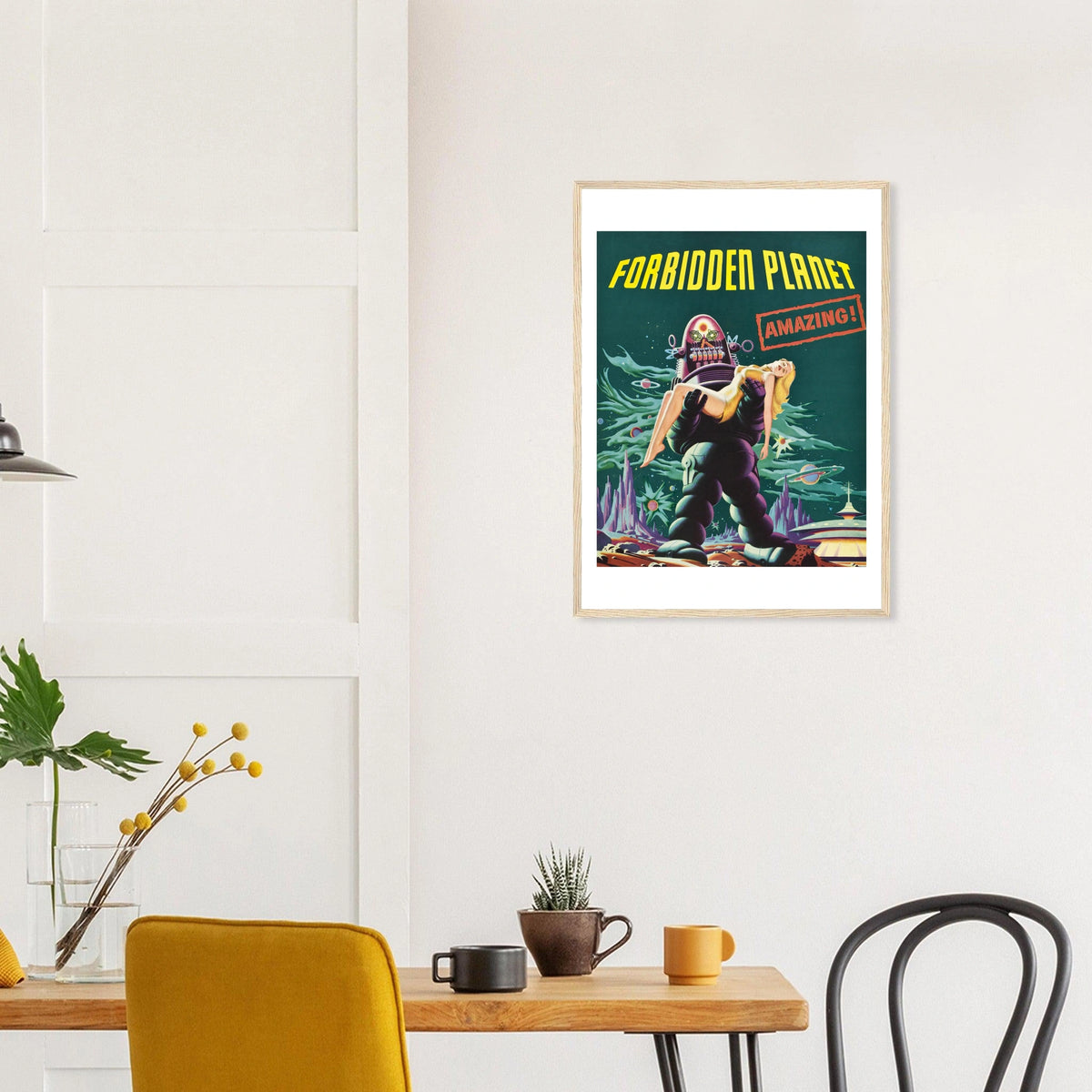 Forbidden Planet in a natural wood frame above a dining table; styled room mockup