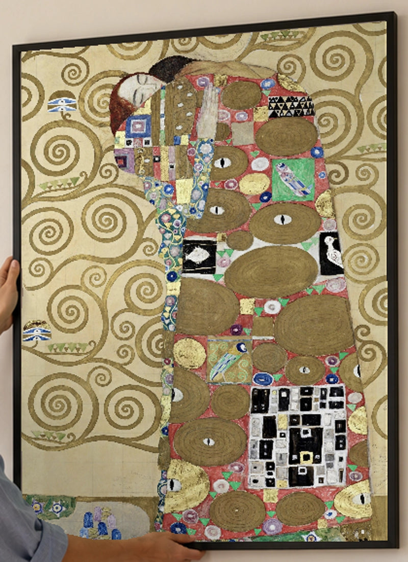 Fulfillment Art Print by Gustav Klimt in a black frame; close-up of the framed artwork.