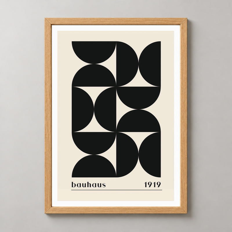 Bauhaus 1919 - Minimalist Geometric Art Print (Black) — realistic natural wood frame studio view