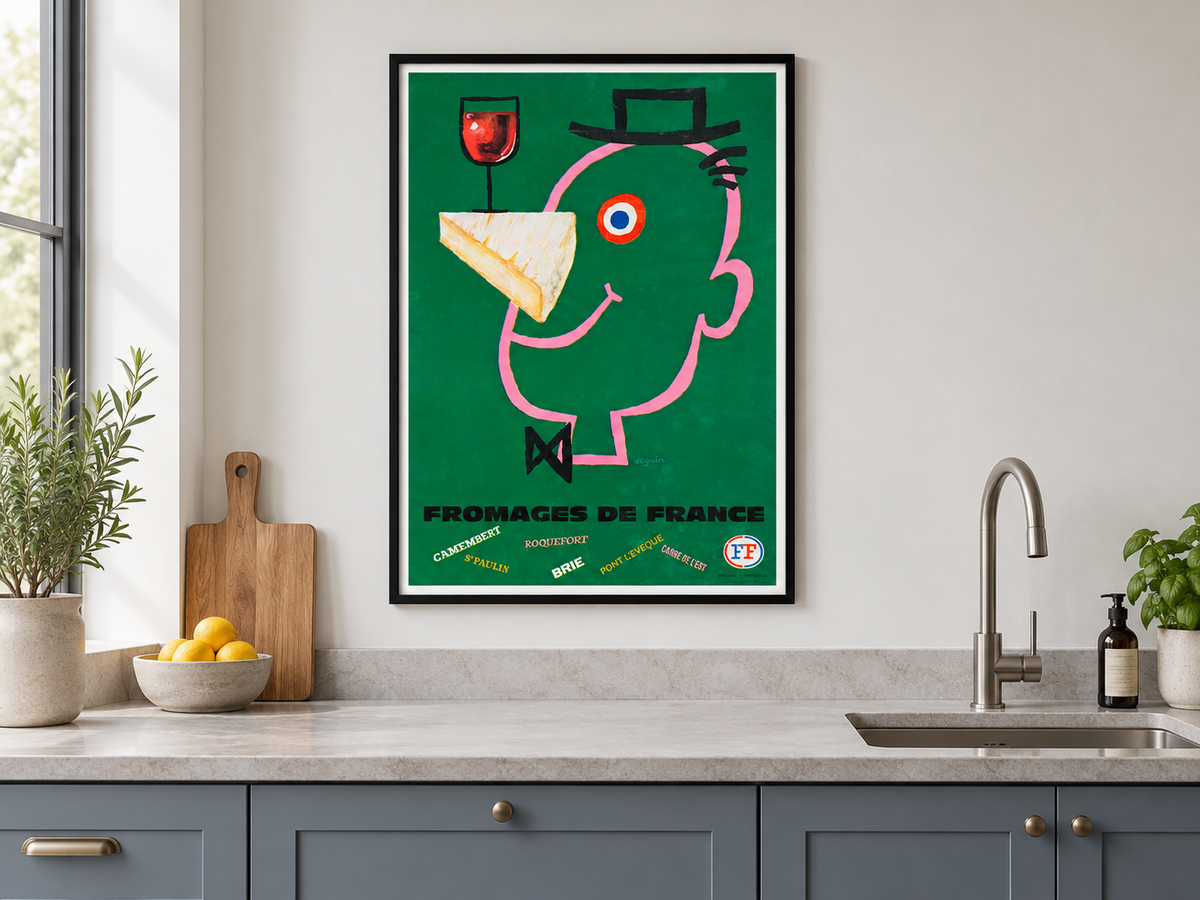Fromages de France print in a black frame above a stone worktop in a blue-grey kitchen