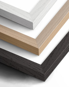 Close-up of the available white, natural wood and black premium wooden frame finishes; one frame per framed print