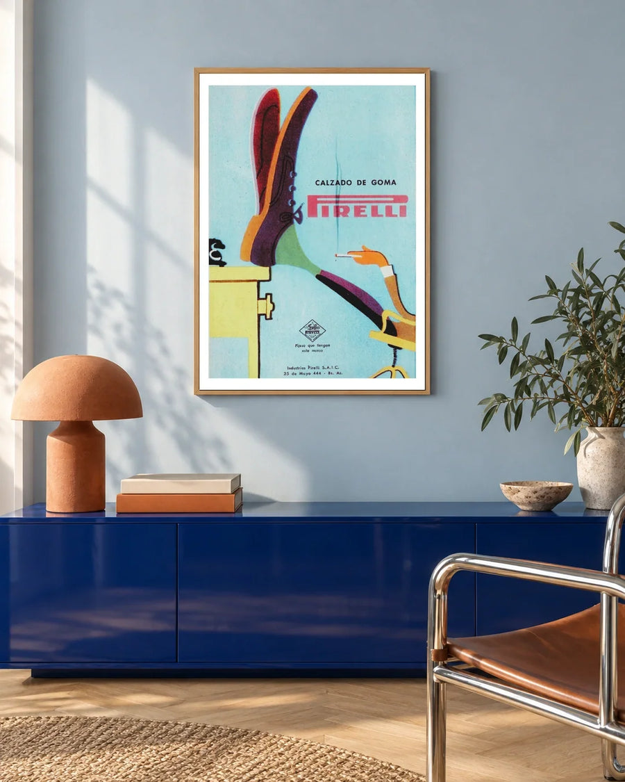 Pirelli Calzado de Goma Shoe Poster — natural wood frame in a blue-toned living space