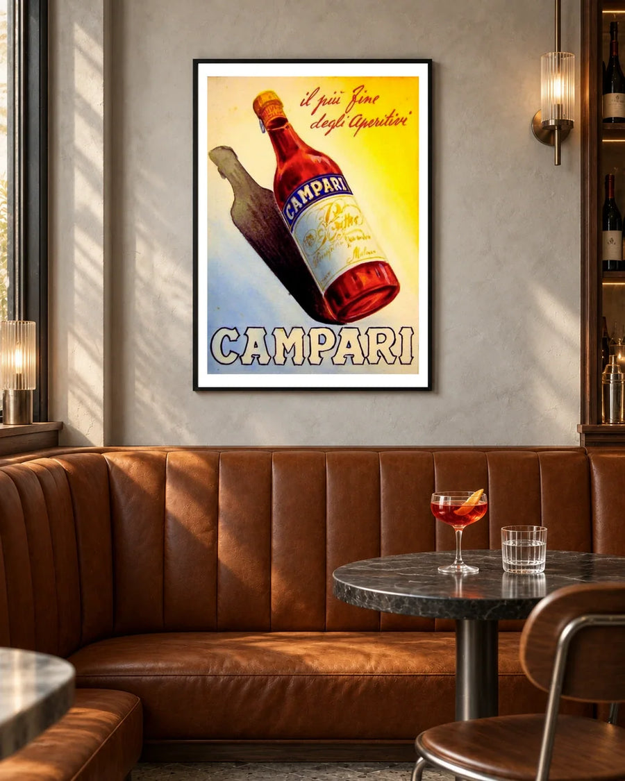Campari Aperitif Bottle and Shadow Poster — black frame in a contemporary bar with grey walls and tan leather seating