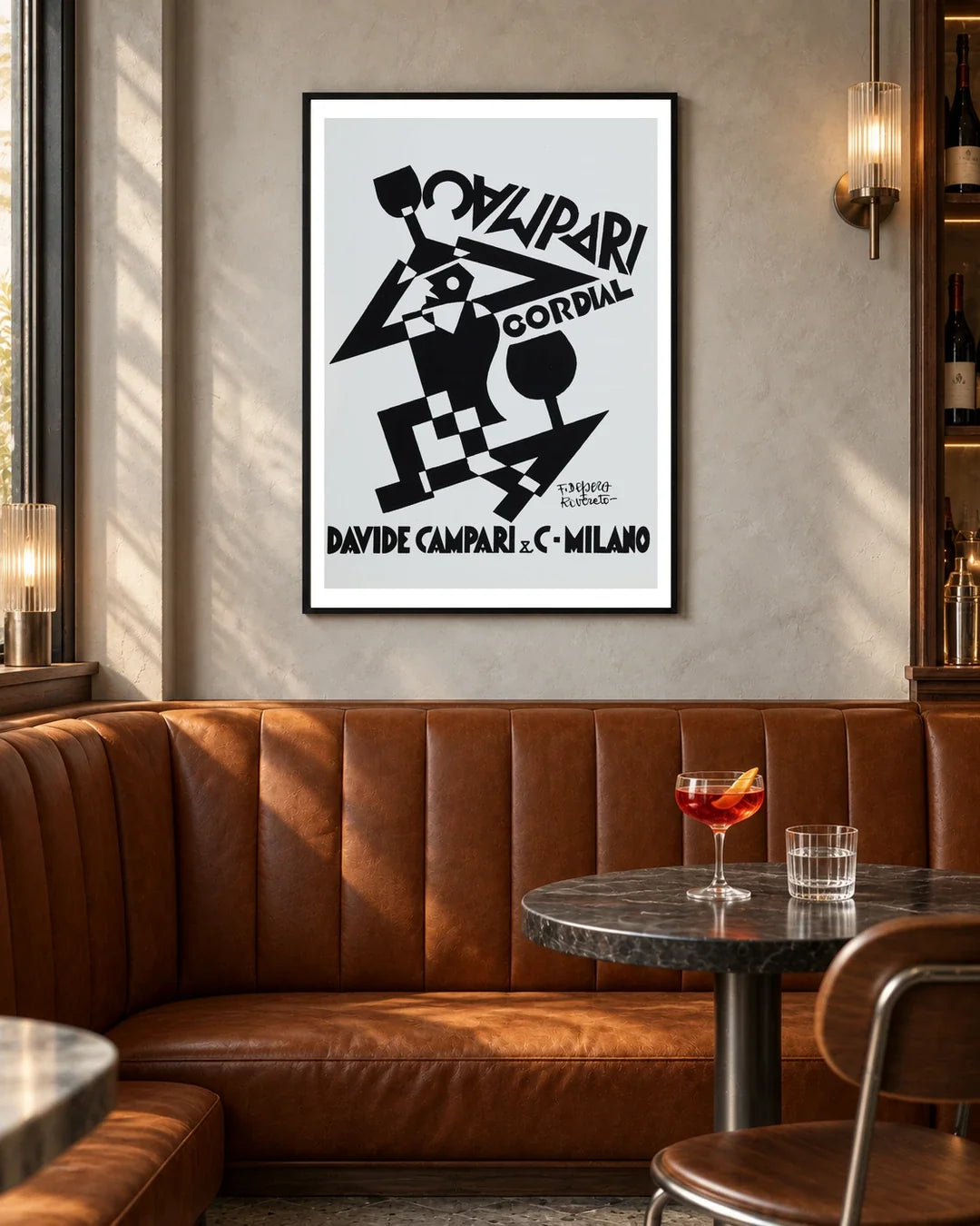 Campari Cordial Black and White Figure Poster by Fortunato Depero — black frame in a contemporary bar with grey walls and tan leather seating