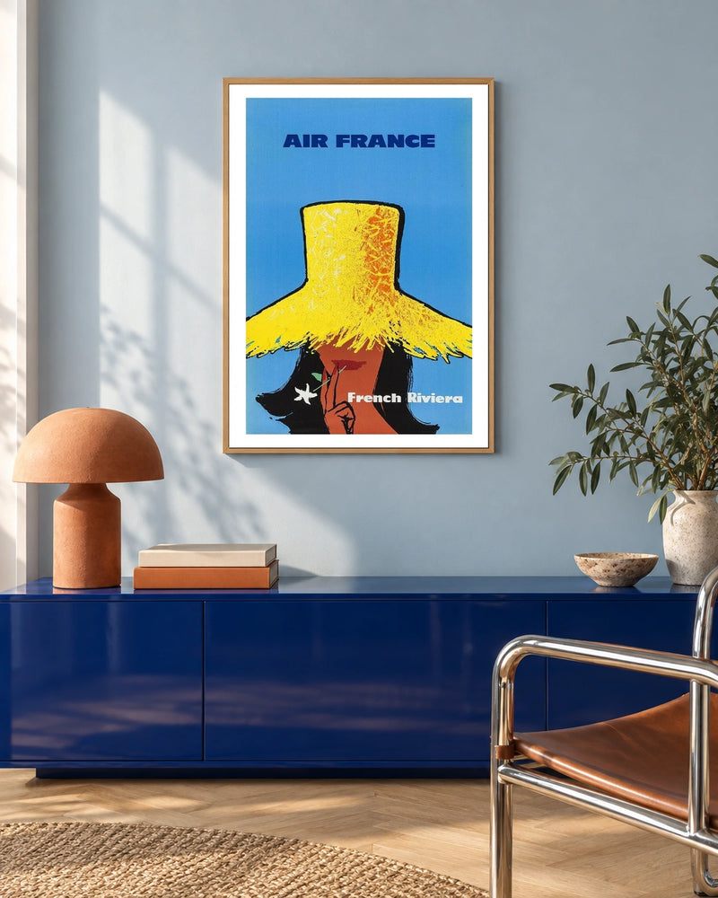 Air France French Riviera Straw Hat Poster — natural wood frame in a blue-toned living space