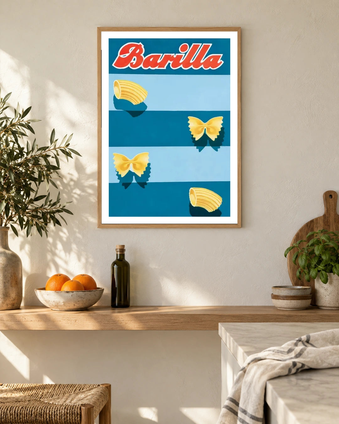 Barilla Pasta Blue Stripes Poster — natural wood frame in a warm, light kitchen