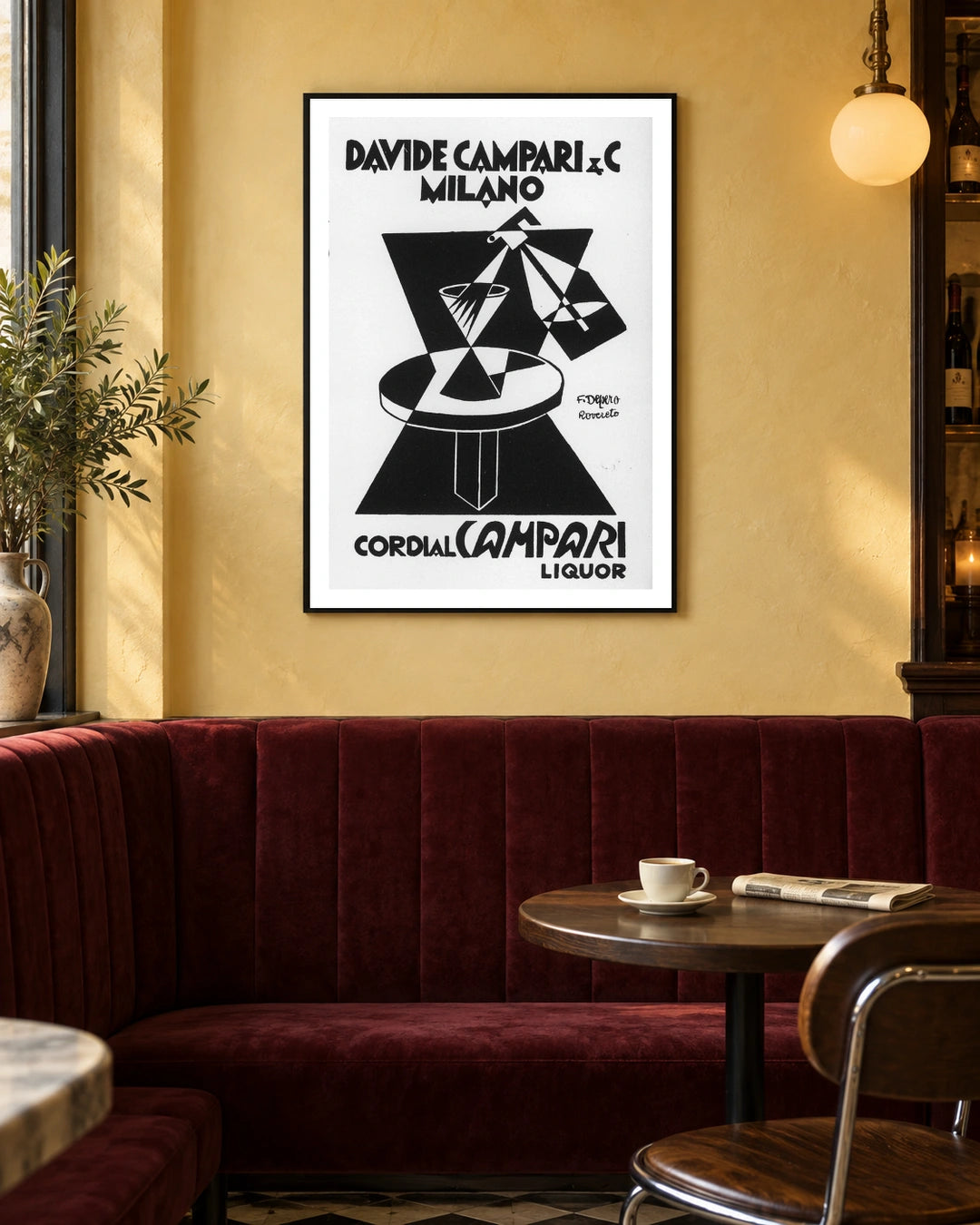 Cordial Campari Geometric Table Poster — black frame in a warm bistro dining space