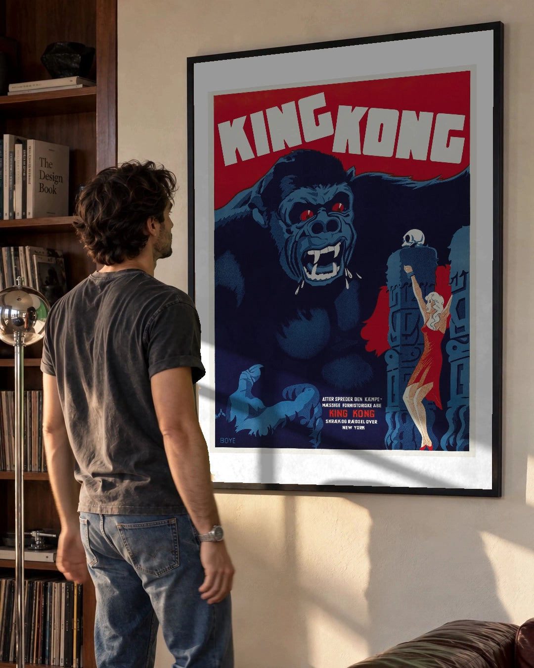 King Kong Danish Vintage Movie Poster (1933) in a black frame; styled man setting.