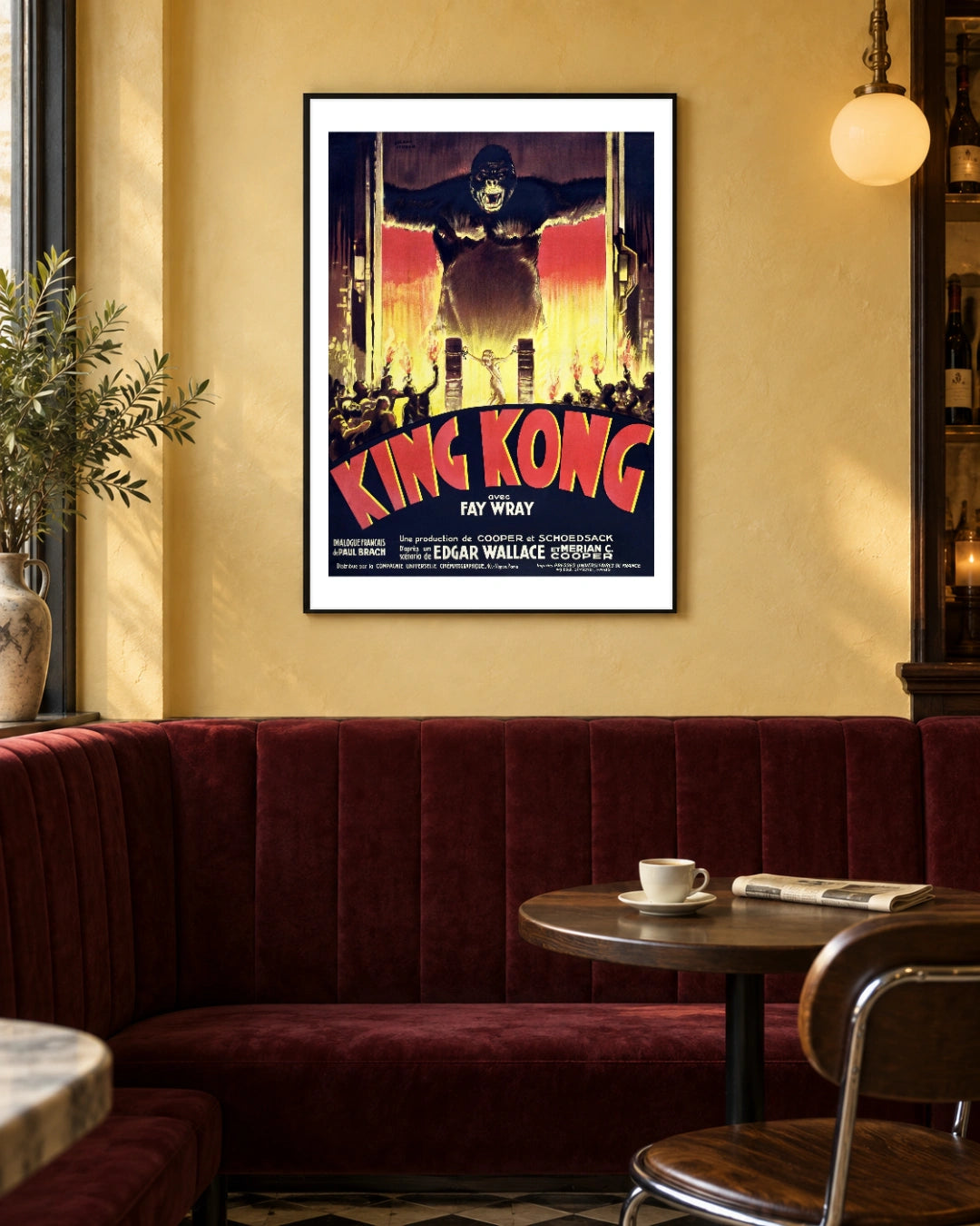 King Kong French Vintage Movie Poster (1933) in a black frame; styled bistro setting.