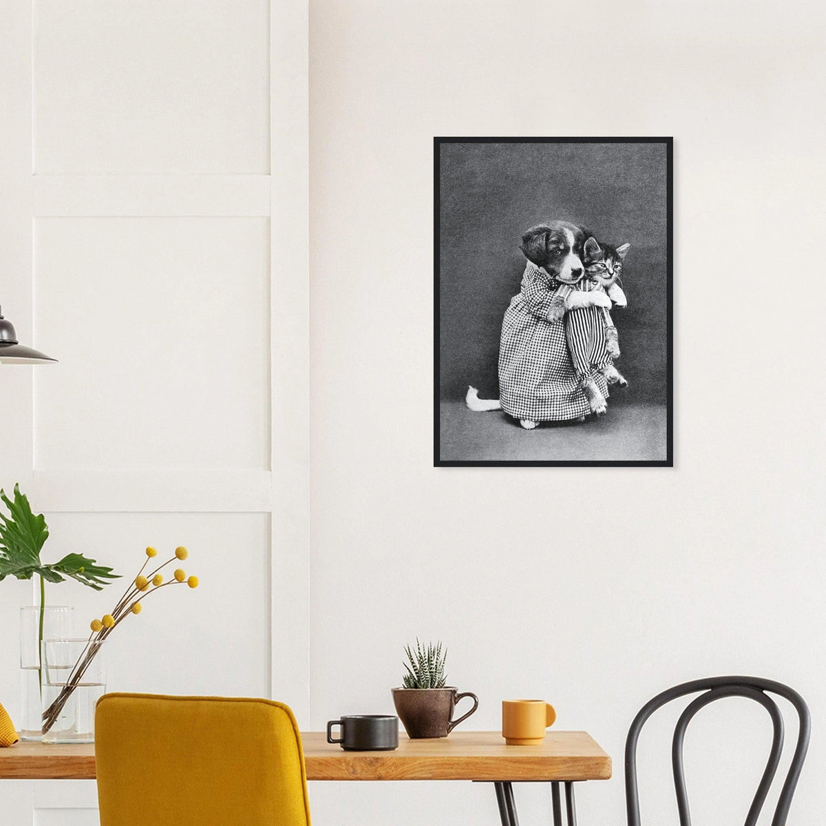 Miss Kindeyes in a black frame above a dining table; styled room mockup