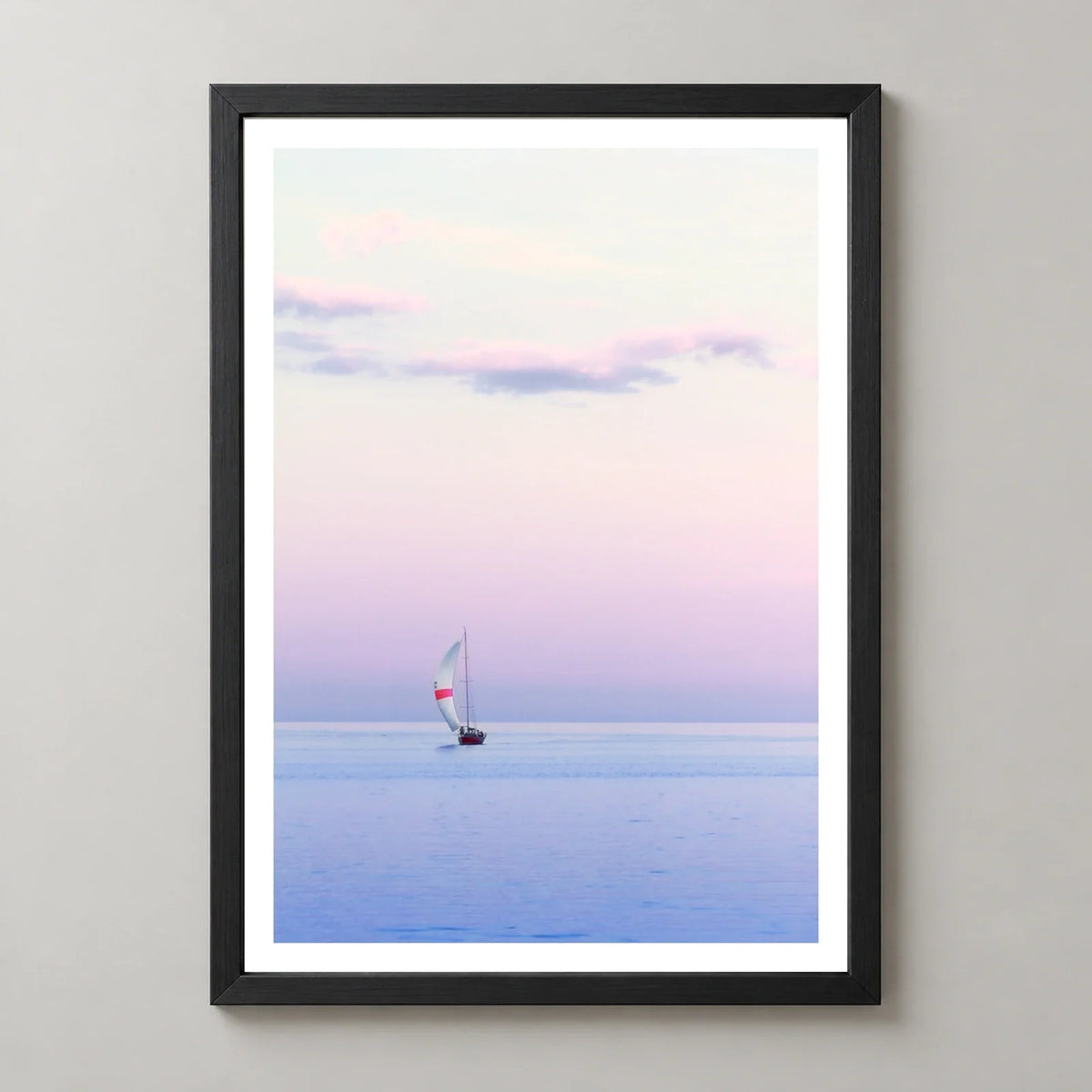 Pastel Sailing Coastal Photographic Print in a black frame, front view