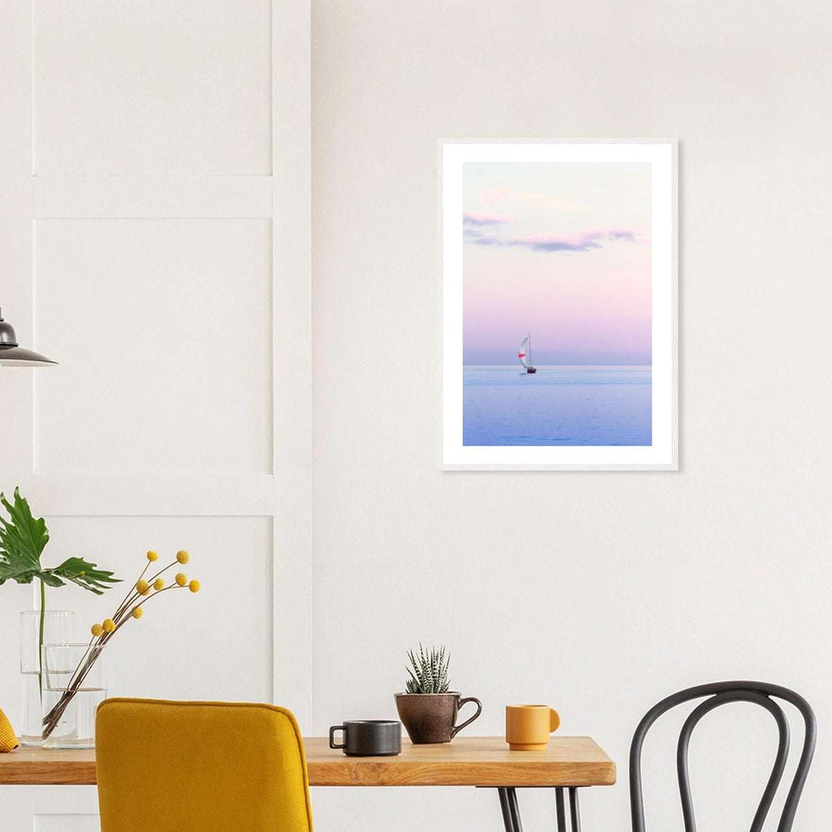 Pastel Sailing in a white frame above a dining table; styled room mockup