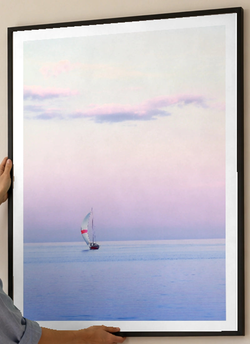Pastel Sailing Coastal Photographic Print in a black frame; close-up of the framed artwork.