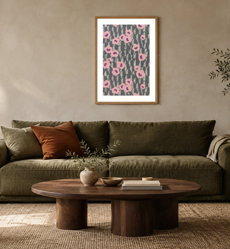 Sidewall — Pink Flowers in a natural wood frame above an olive sofa; styled living-room mockup