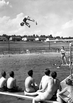 Poolside Oak Ridge Vintage Photographic Print (1947). A diver hangs in the air while friends watch from the poolside in Oak Ridge, 1947