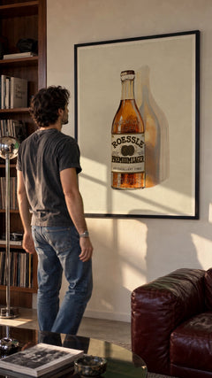 Roessle Premium Lager print in a black frame in a styled hanging scene