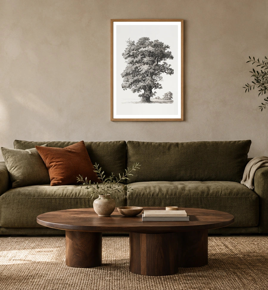 Studies after Nature — Tree in a natural wood frame above an olive sofa; styled living-room mockup