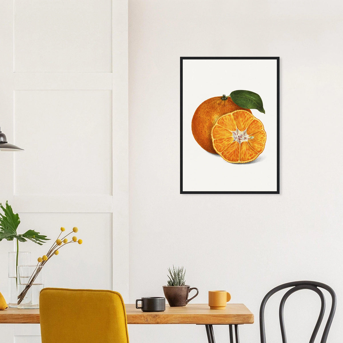 Tangerine Study in a black frame above a dining table; styled room mockup