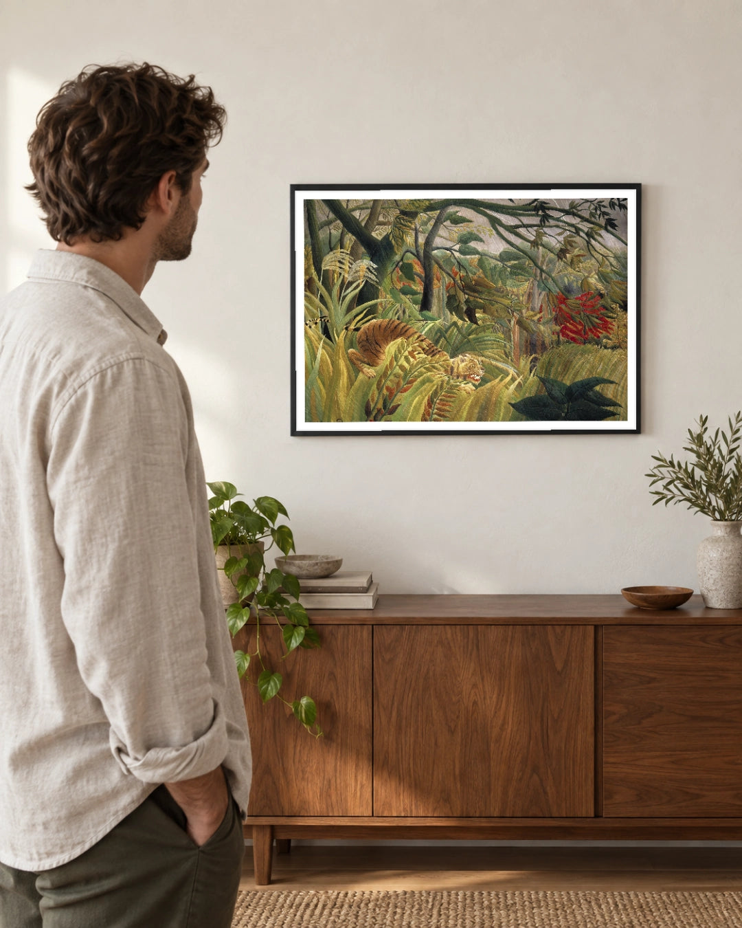 Tiger in a Tropical Storm Art Print by Henri Rousseau in a black frame; styled viewer landscape setting.