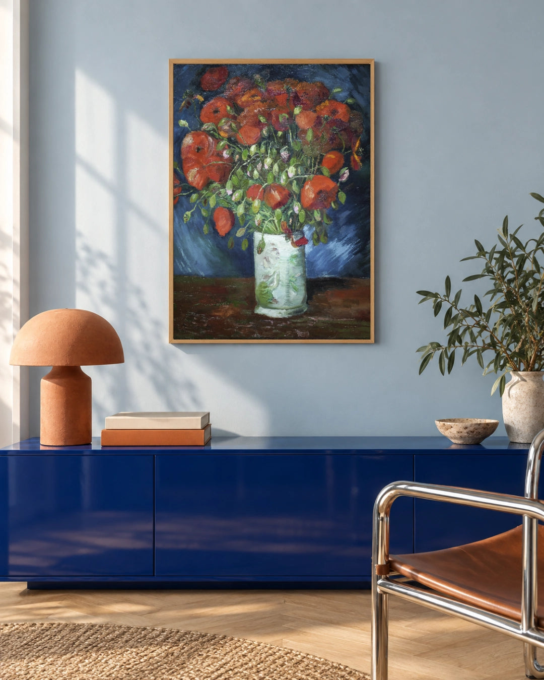 Vase with Poppies Art Print by Vincent van Gogh in a natural wood frame; styled modern setting.